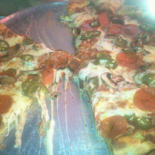Photo taken at Mama Gina&#39;s Pizzeria by Arnold C. on 11/14/2011