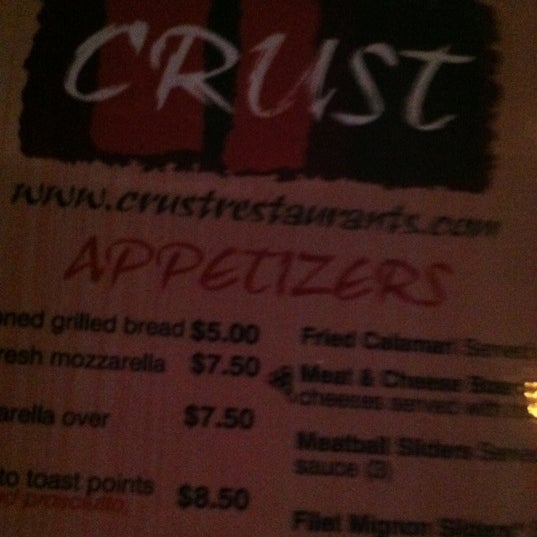 Photo taken at Crust Pizza &amp; Wine Cafe by Jenn K. on 6/28/2012