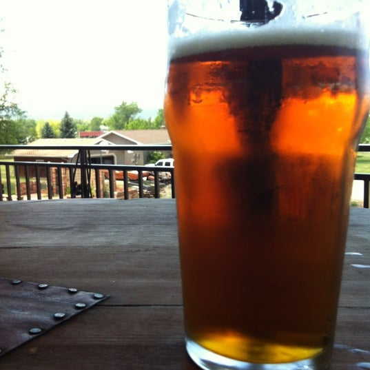 Photo taken at Crow Peak Brewing Company by Jessica B. on 7/8/2012