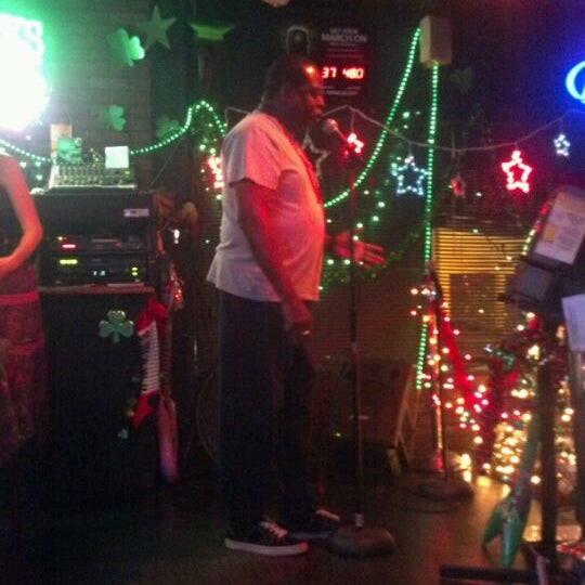 Foto diambil di O&#39;Shucks Pub &amp; Karaoke Bar oleh Alex S. pada 12/18/2011