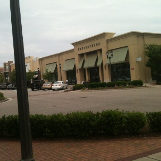 Photo taken at Mayfaire Town Center by Alli C. on 6/2/2012