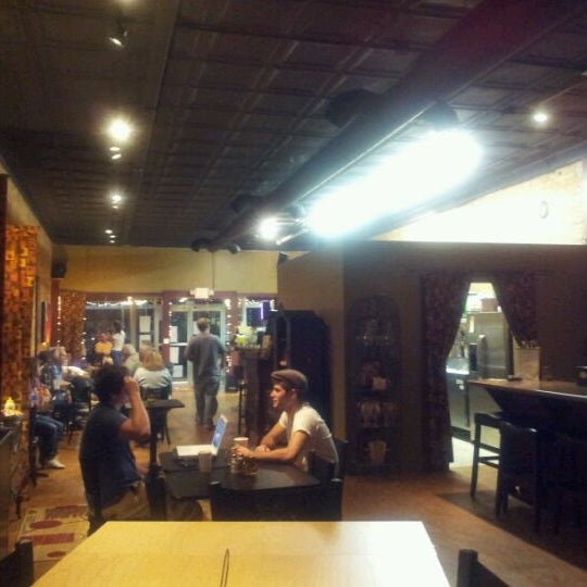 Photo taken at Stomping Grounds Coffee &amp; Wine Bar by Scott S. on 5/9/2012