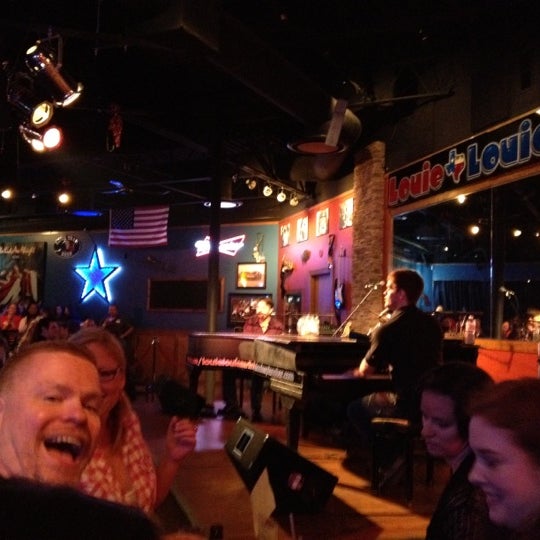 Photo taken at Louie Louie&#39;s Dueling Piano Bar by Dax D. on 3/11/2012