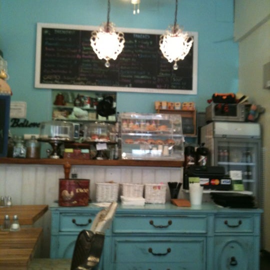 Photo taken at La Bouche Cafe by Mike L. on 6/28/2012