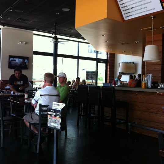 Photo taken at Village Burger Bar by deedra g. on 5/27/2012