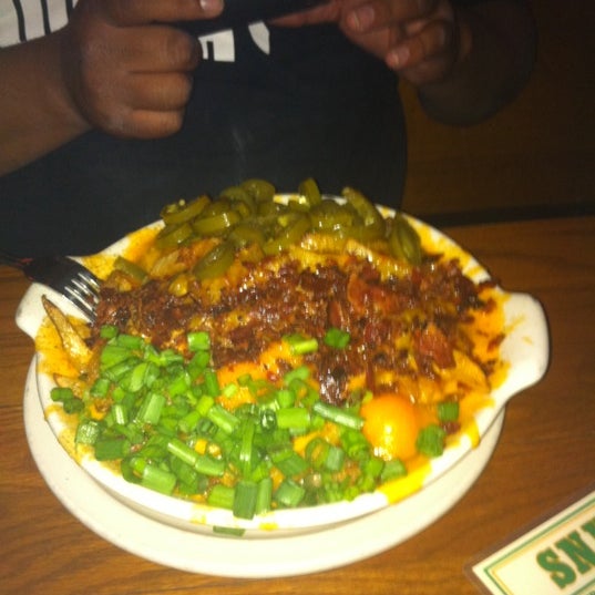 Photo taken at Snuffers by Mario X. on 3/12/2011