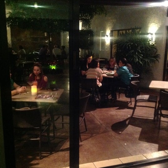 Photo taken at El Café 57 by Monserrat G. on 3/30/2012