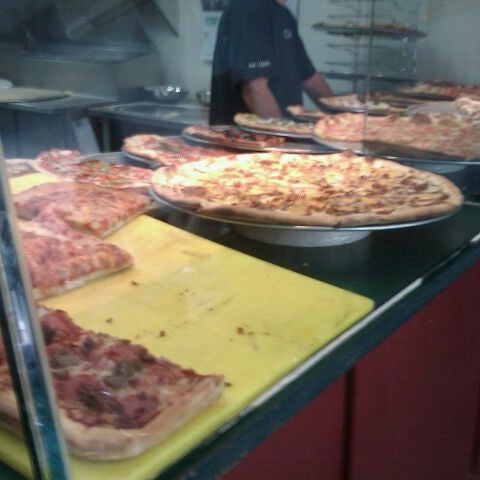 Photo taken at Slices Pizza by Angelica V. on 9/7/2011