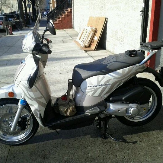 Photo taken at Vespa Brooklyn / Aprilia Brooklyn / Moto Guzzi Brooklyn by Kimberly J. on 3/28/2012