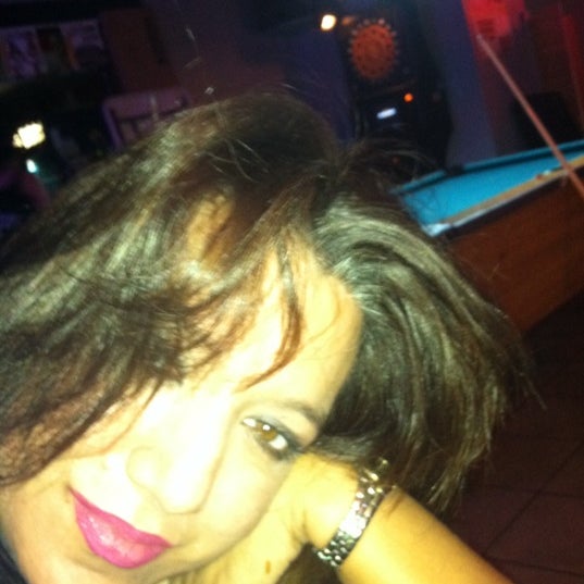 Photo taken at Charlie Brown&#39;s Neighborhood Bar &amp; Grill by Ilze R. on 12/18/2011