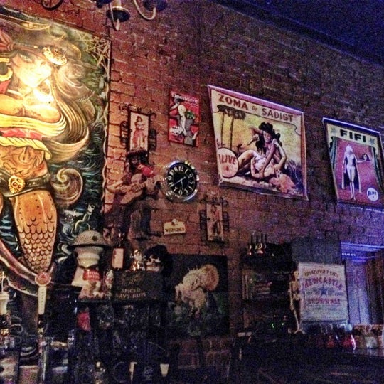 Photo taken at Surly Wench Pub by Juan G b. on 12/31/2011