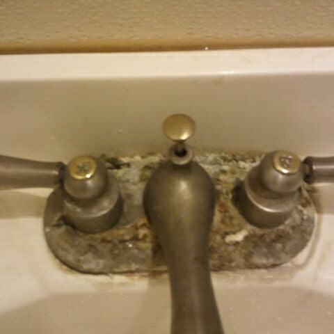 The faucet in the mens restroom looks like its growing barnacles.