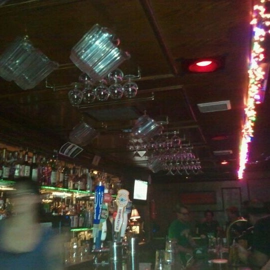 Photo taken at Backstage Bar &amp; Grill by Cheryl B. on 12/15/2011