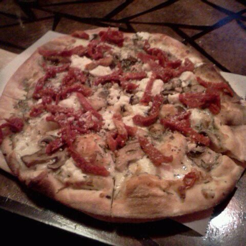 Photo taken at SoLo Wood-Fired Pizza by Julie M. on 4/12/2012
