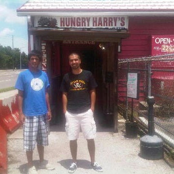 Photo taken at Hungry Harry&#39;s Famous BBQ by Carlos G. on 8/15/2012
