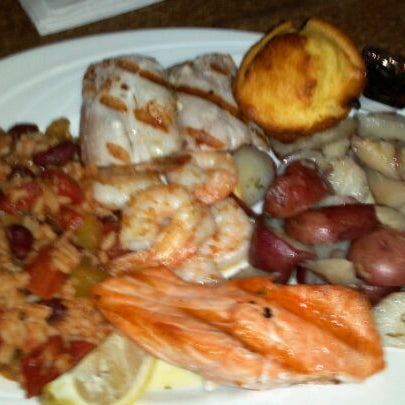 Photo taken at Gulf Shore Restaurant &amp; Grill by Andrew B. on 12/31/2011