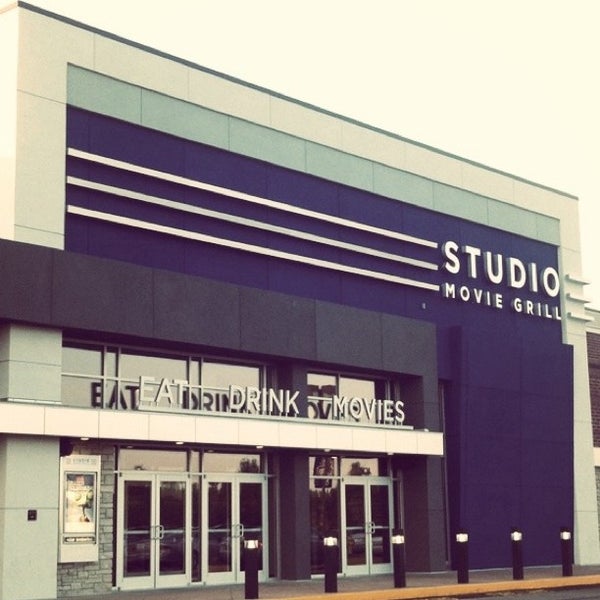 Photo taken at Studio Movie Grill Wheaton by Charlotte E. on 7/12/2012