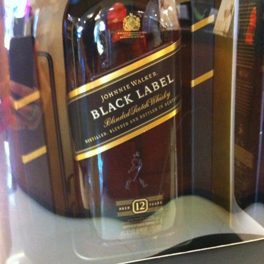 Снимок сделан в Global Liquors пользователем @kdeamat ™. 3/30/2012