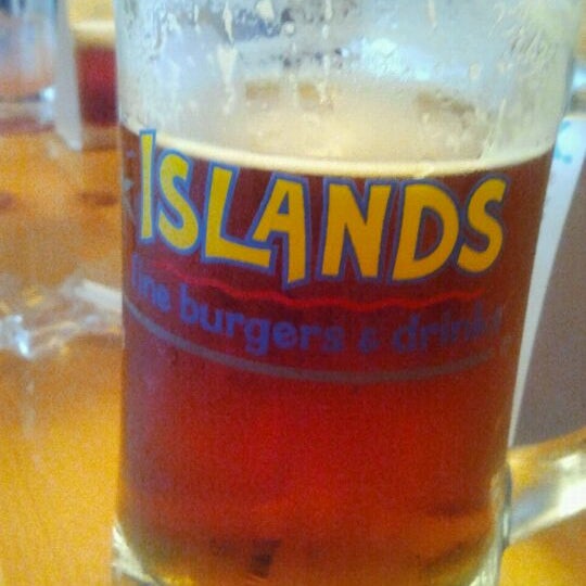 Photo taken at Islands Restaurant Long Beach Towne Center by Kyle J. on 3/24/2012