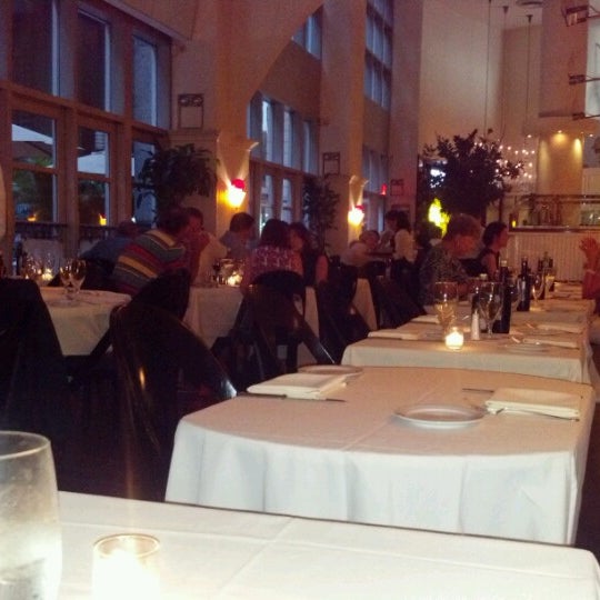 Photo taken at Remi Restaurant by Andrea H. on 7/28/2012