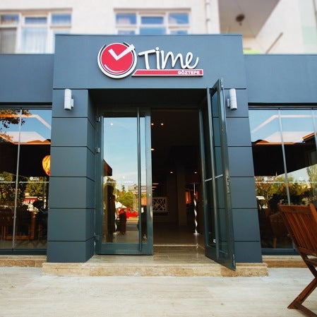 Photo taken at Time Café &amp; Restaurant by Bulent A. on 9/24/2011