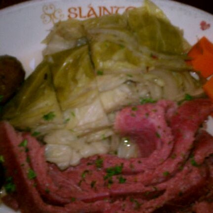 Photo taken at Slainte Irish Pub + Kitchen by Heather R. on 2/15/2012