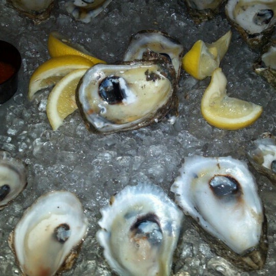 Photo taken at Doc Magrogan&#39;s Oyster House by Melissa L. on 8/7/2012