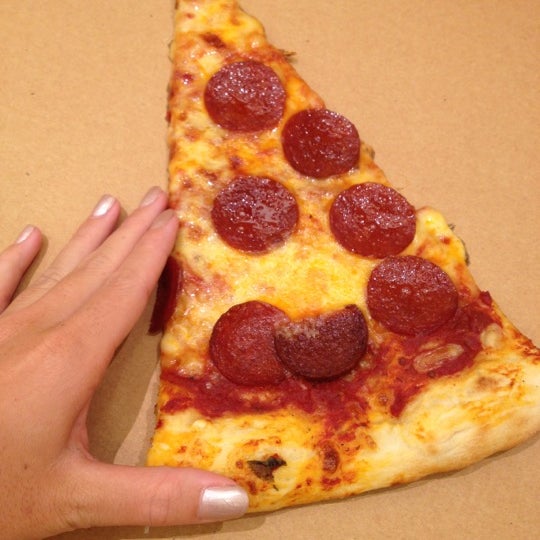 The pizza slice is huge! Pepperoni only $5.20