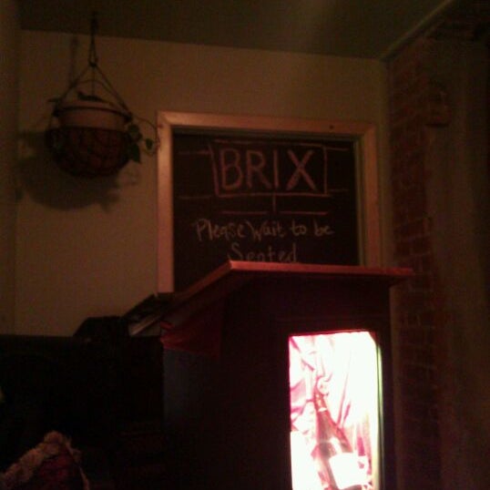 Photo taken at Brix Restaurant and Wine Bar by Victoria W. on 1/1/2012