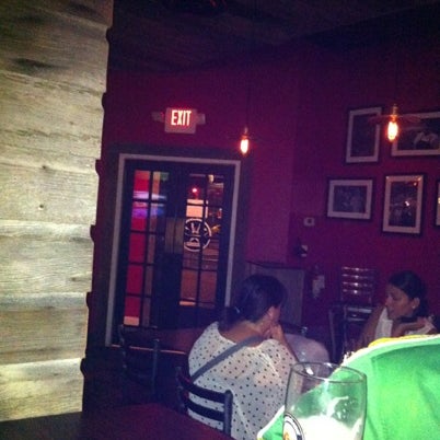 Photo taken at The Industry Bar by Carlos O. on 8/7/2012