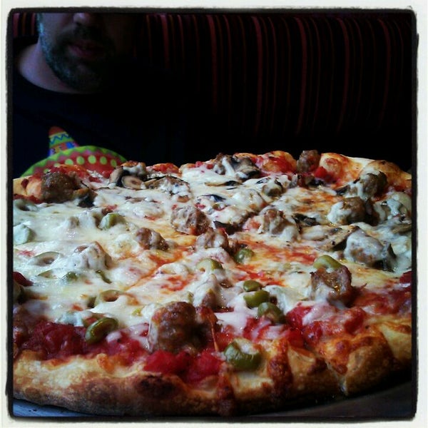 Photo taken at Galactic Pizza by Sarah A. on 5/2/2012
