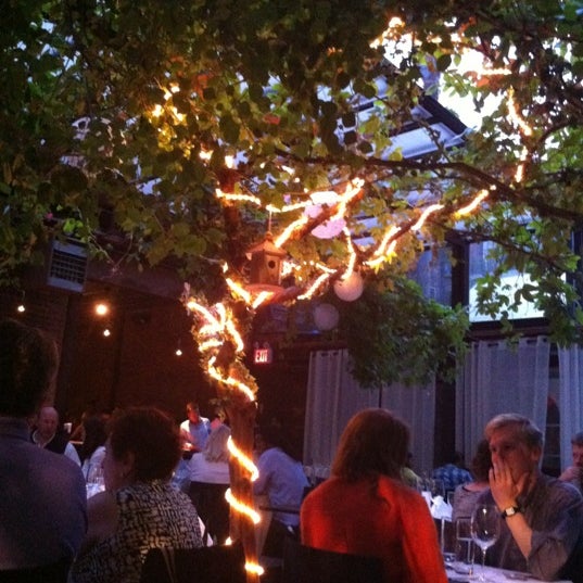 Photo taken at Revel Restaurant and Garden by Patrick S. on 5/21/2012