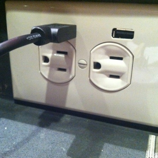 They have outlets with USB ports at the bar.