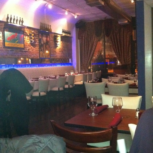Photo taken at Corlette NY Restaurant &amp; Lounge Caribbean Tacqueria by Ryan D. on 1/22/2012