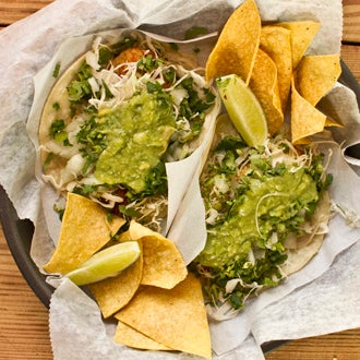 Try the taco de pescado here, featuring golden fried fingers of beer-battered mahi-mahi. It's one of NYC's 26 best tacos!