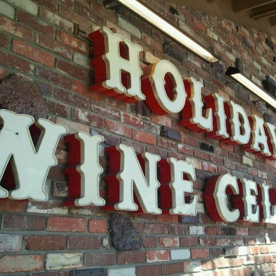 Photo taken at Holiday Wine Cellar by DiningOutSD on 2/22/2012