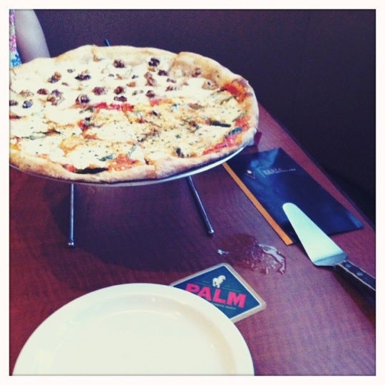 Photo taken at Vesta Wood Fired Pizza &amp; Bar by Manolo on 9/12/2011