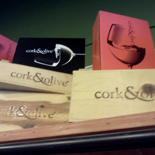 Photo taken at Cork &amp; Olive by Topher A. on 7/13/2012