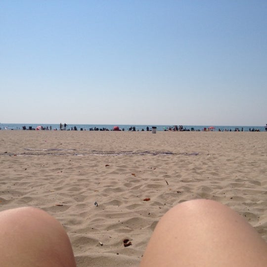 Photo taken at Cobourg Beach by Juliana P. on 8/25/2012