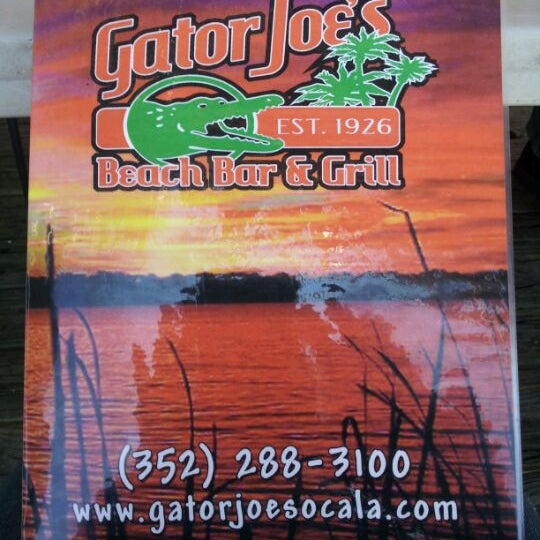 Photo taken at Gator Joe&#39;s Beach Bar &amp; Grill by Winnie D. on 10/5/2011