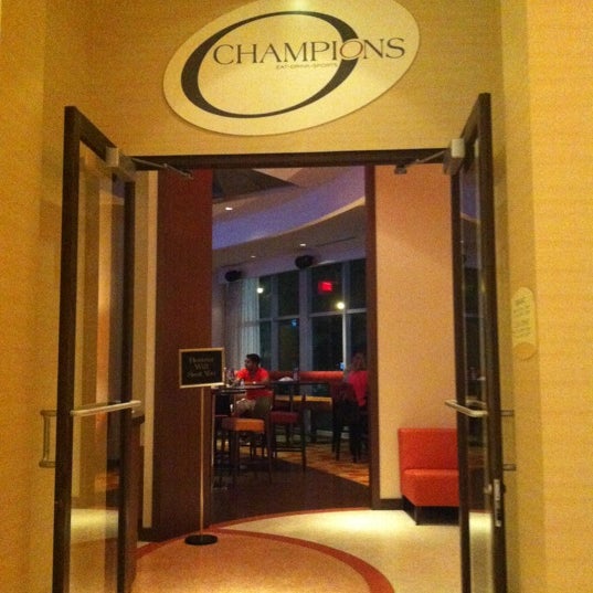 Photo taken at Champions Sports Bar by Jorge R. on 5/29/2012