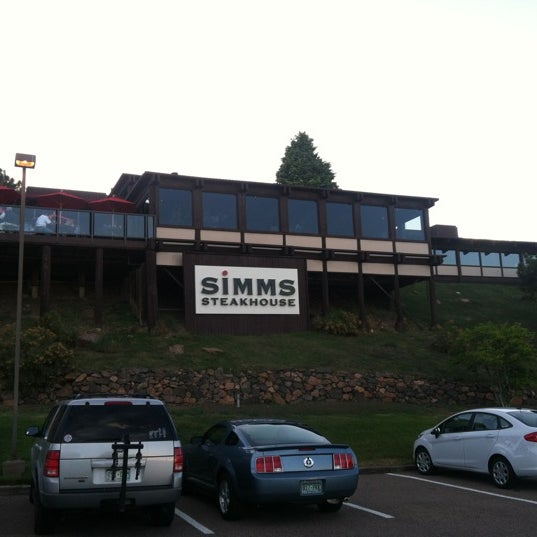 Photo taken at Simms Steakhouse by Sean W. on 5/5/2012