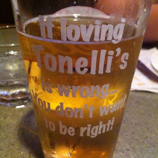Photo taken at Tonelli&#39;s Pizza Pub by Krista C. on 6/8/2012
