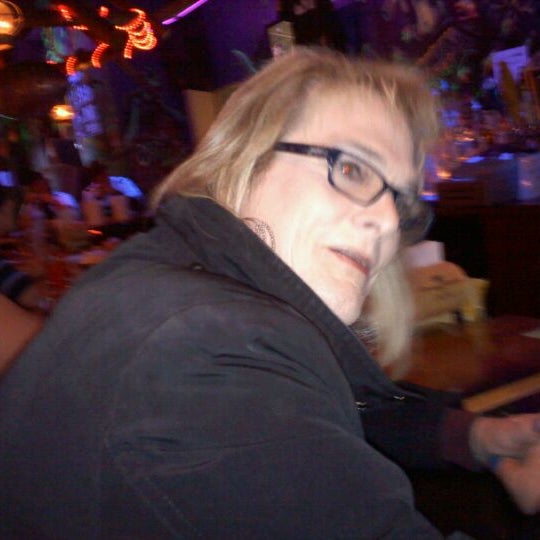 Photo taken at Gilligan&#39;s Tropical Bar &amp; Grill by Nathan F. on 12/4/2011