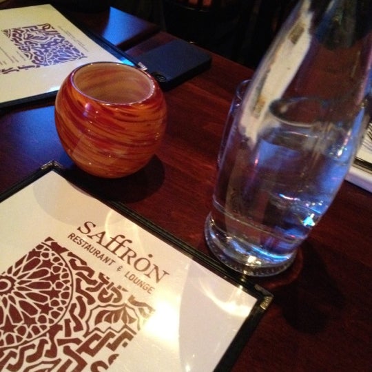 Photo taken at Saffron Restaurant &amp; Lounge by Naomi O. on 1/21/2012