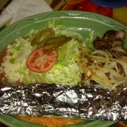 Photo taken at Los Agaves Mexican Grill by Sarah E. on 4/6/2012