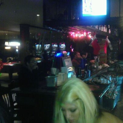Photo taken at Hooligan&#39;s Bar &amp; Grill by Myron M. on 12/24/2011