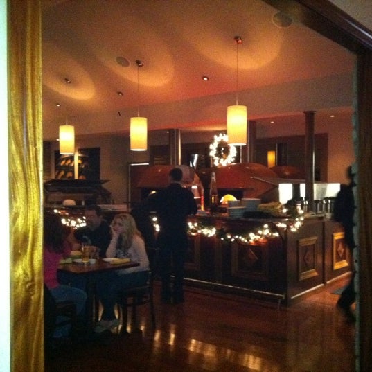 Photo taken at Vesta Wood Fired Pizza &amp; Bar by Bobbie B. on 12/31/2011