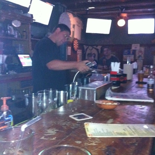 Photo taken at Mad Donkey Beer Bar &amp; Grill by Melanie B. on 8/4/2011