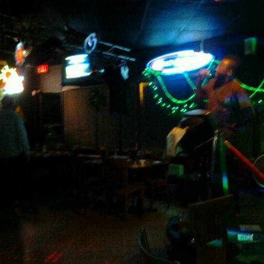 Foto diambil di O&#39;Shucks Pub &amp; Karaoke Bar oleh Jillian S. pada 1/14/2012
